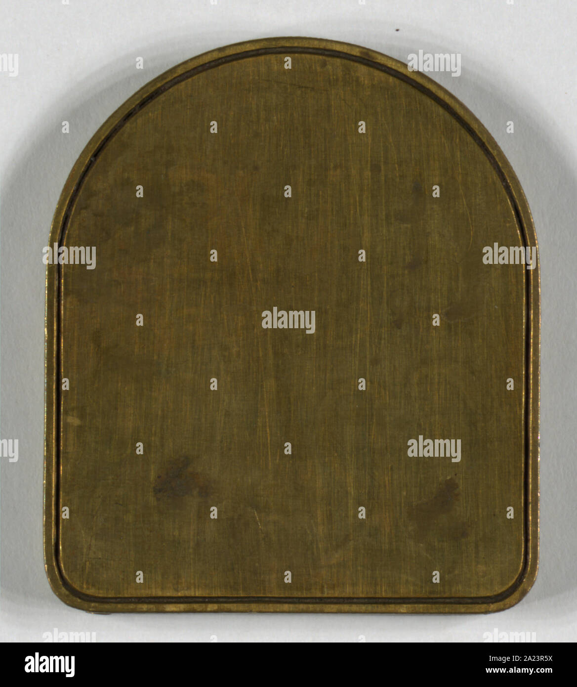 Original brass dies used for 1860 edition of leaves of grass. blank tombstone-shaped plate Stock Photo