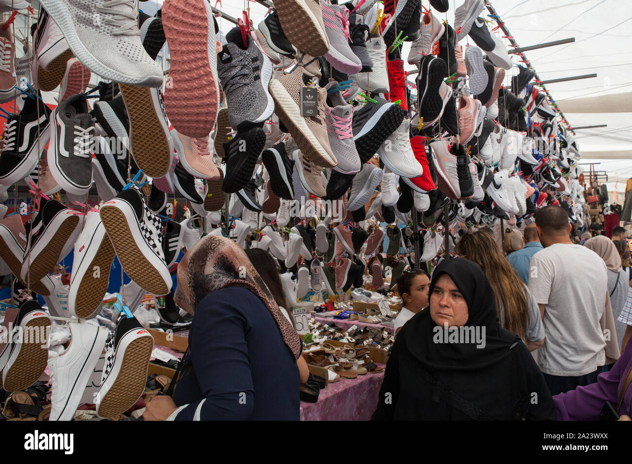 Display of footwear for sale at a street market in the Fatih district of Istanbul Stock Photo