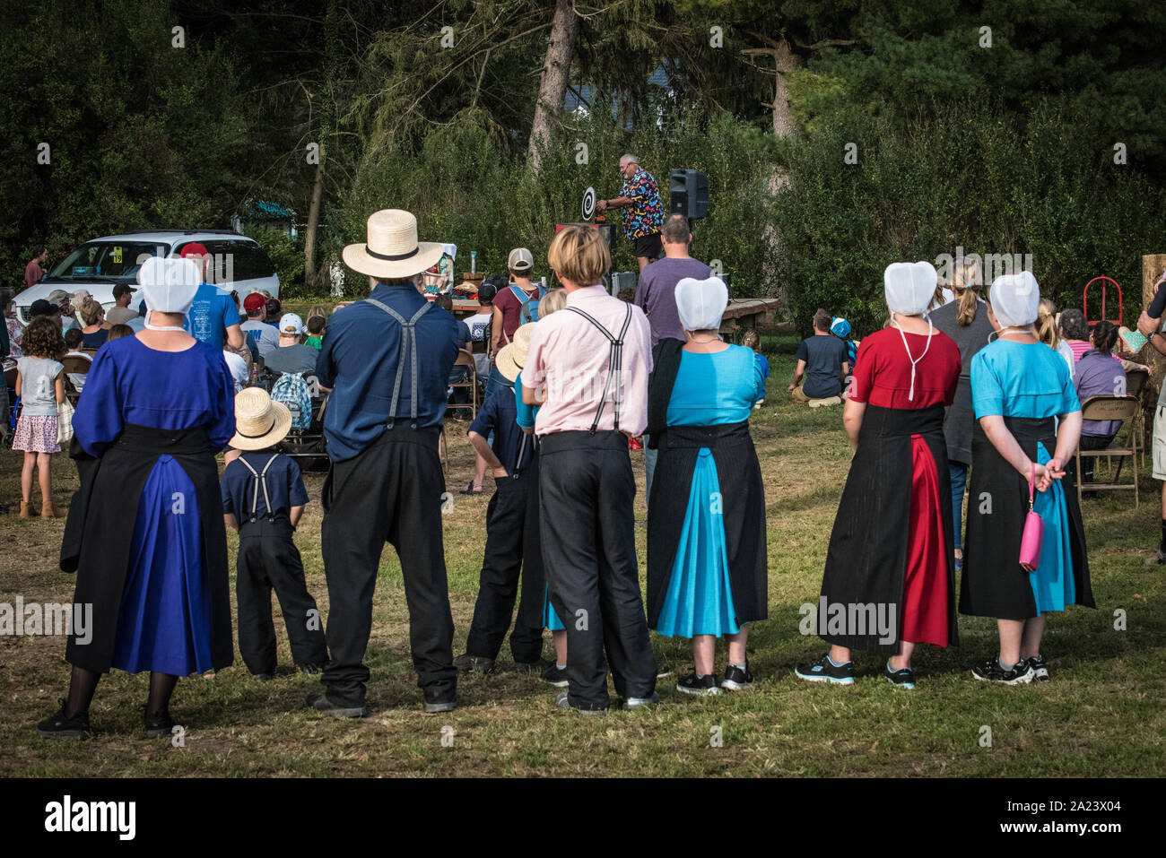 Amish family at country fair, auction Stock Photo Alamy