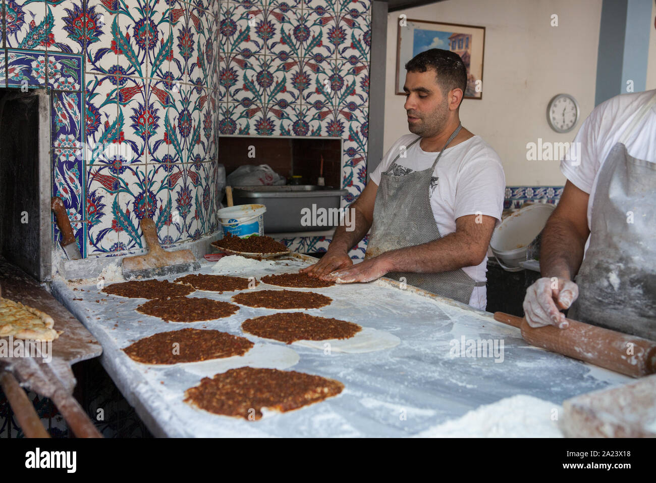 A baker prepares pide (Turkish pizza) in a restaurant in Istanbul Stock Photo