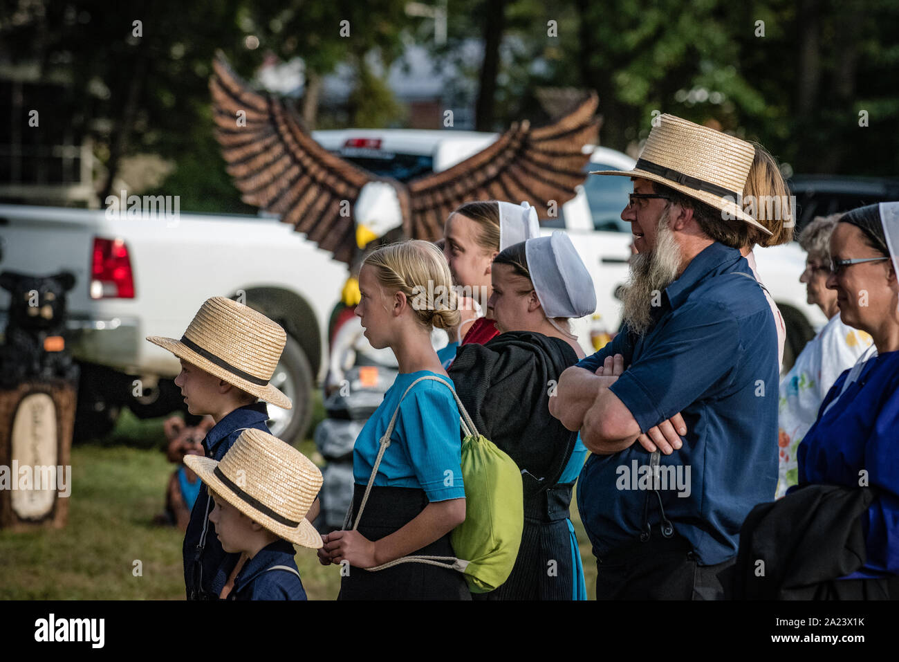 Amish family at country fair, auction Stock Photo Alamy