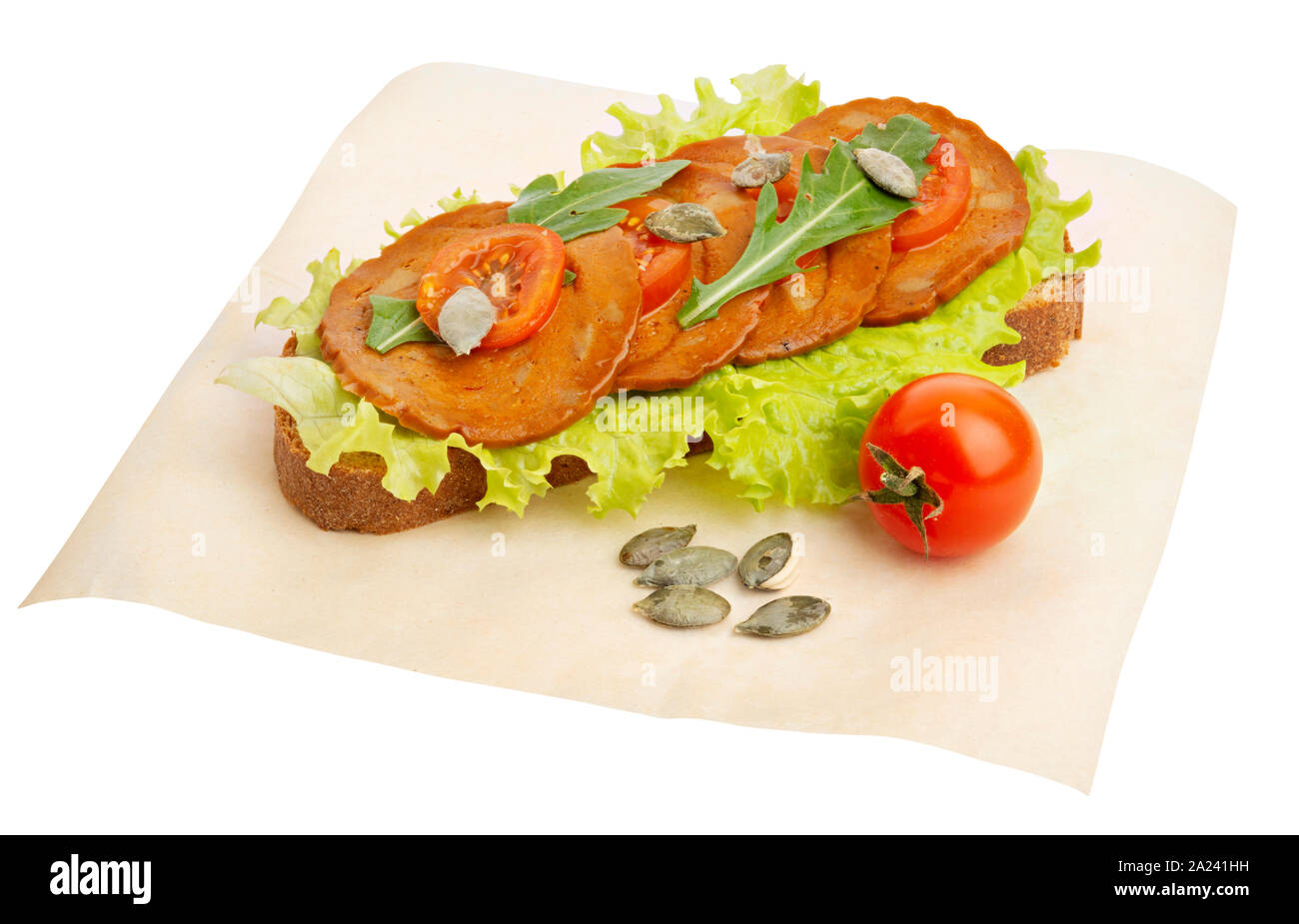 Vegan sandwich with seitan salami medallions rucola, pumpkin seeds and tomatoes Stock Photo Alamy