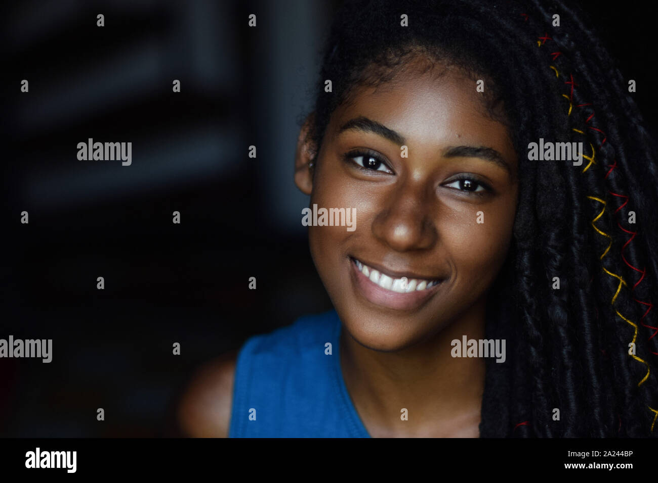 Interior close up portrait of young black woman with dreadlocks, Cali, Colombia Stock Photo