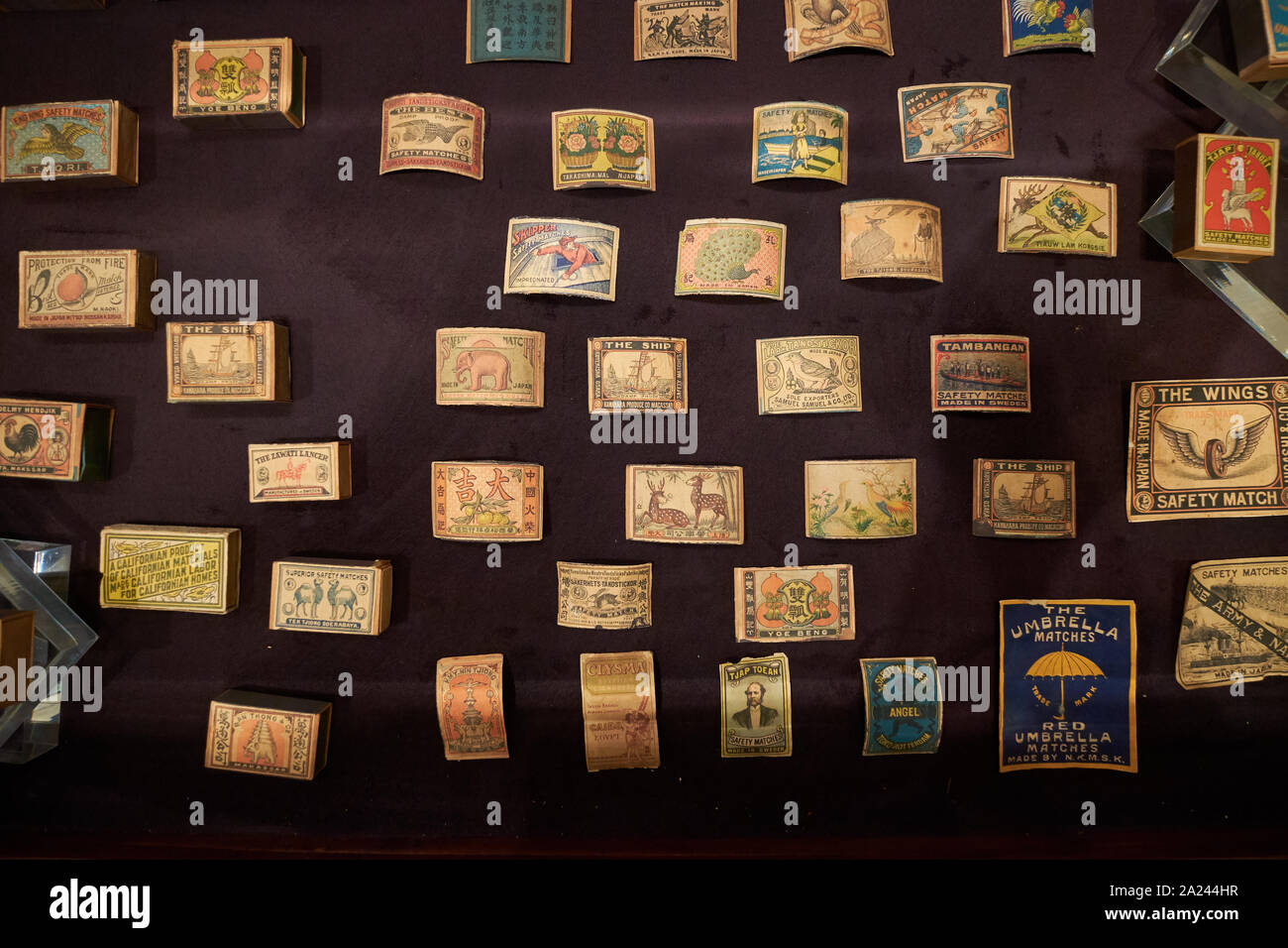 Old matchbox paper labels at the official museum at the House of Sampoerna, a clove and tobacco cigarette factory in Surabaya, Indonesia. Stock Photo