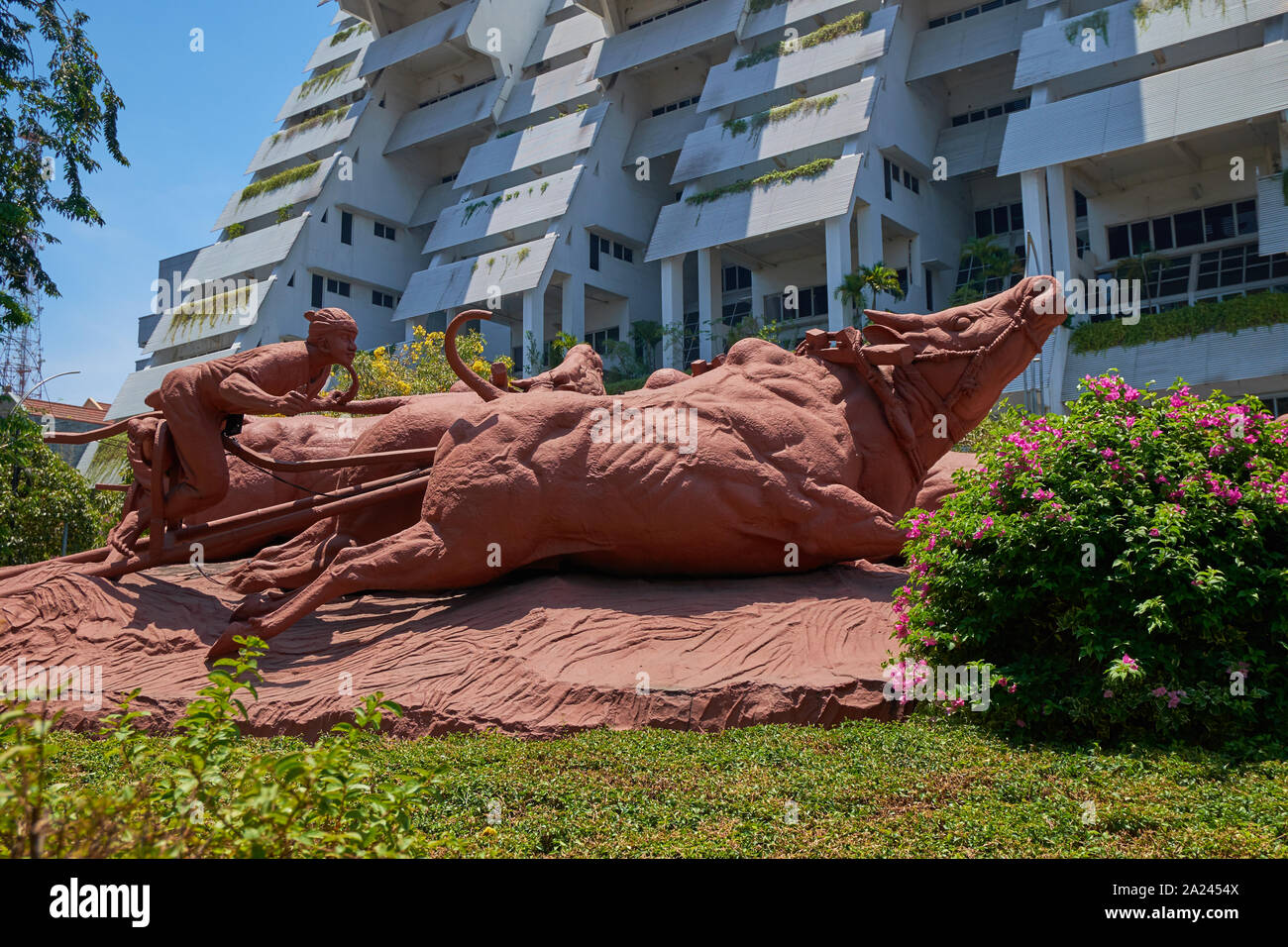 A big sculpture of a rider racing bulls. The sport is called Karapan ...