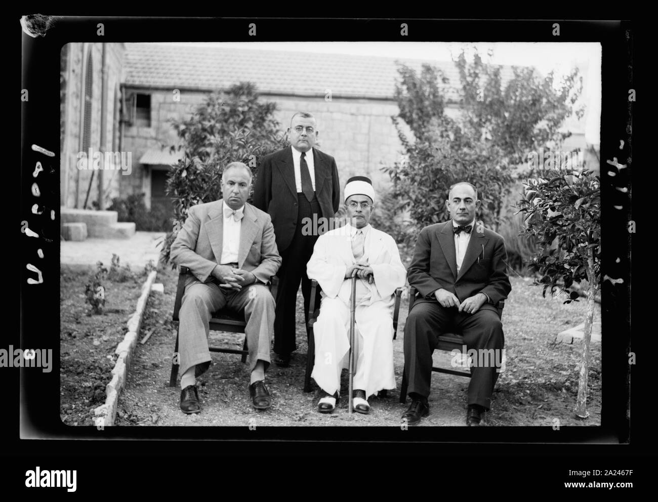 Palestine Broadcasting Service groups taken on Aug. 8, 1942 (Arabs & Jews). Group of three: Sheik Mustapha el Ghalani (center), Samy Bek el Kayali and Shafik Bek Jabri and Ajaj Eff (standing) Stock Photo