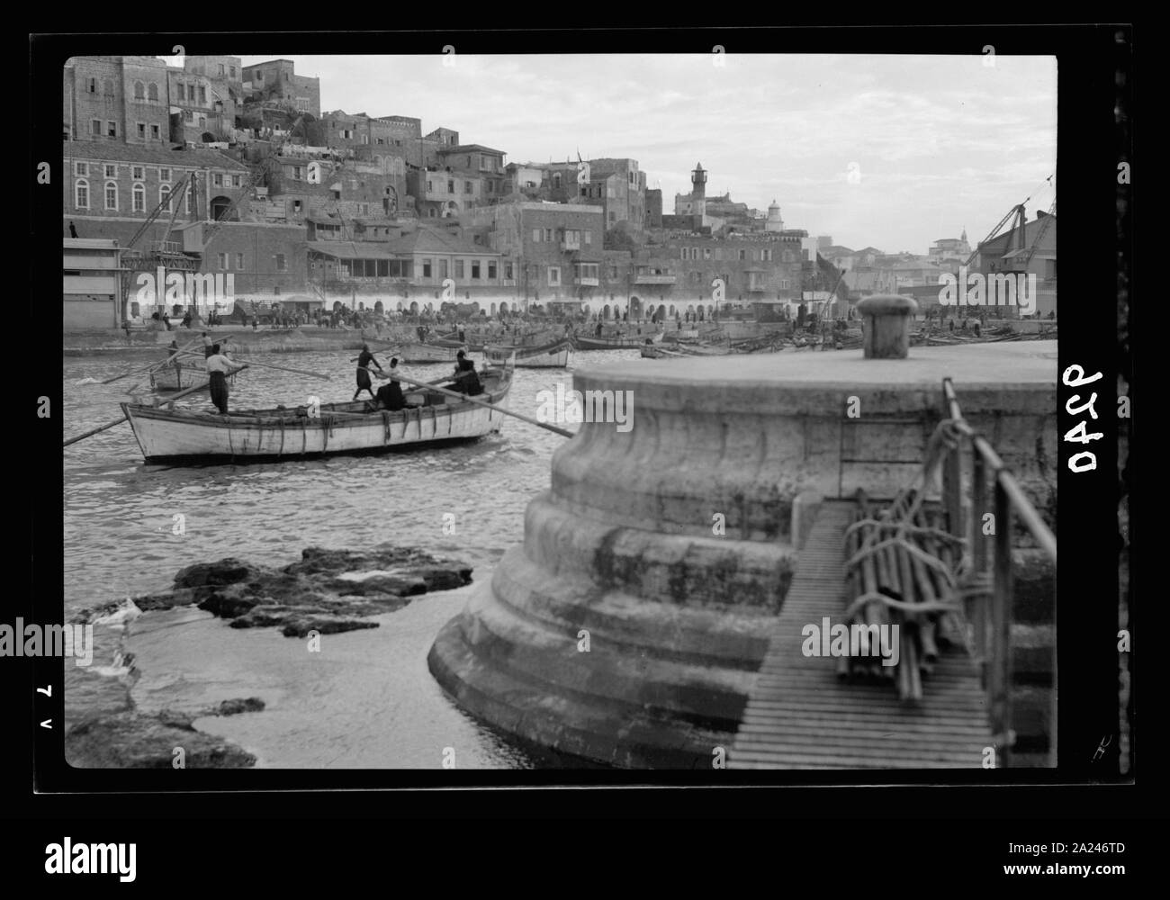 Palestine disturbances 1936. New Jaffa sea-front, as seen from the seaward end of the new break-water, at the right. View is looking across the lighter port. House of Simon the Tanner is to the right of the distant minaret Stock Photo