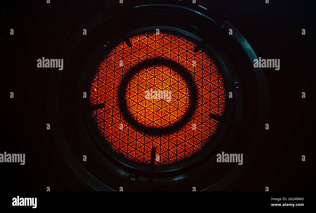 Infrared radiation technology on ceramic pattern of gas stove Stock