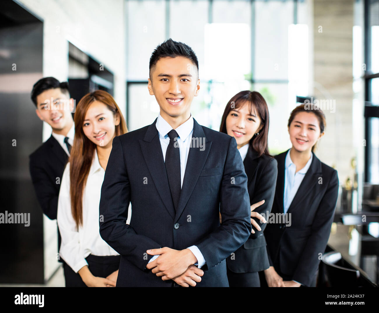 confident asian business team stands in office Stock Photo