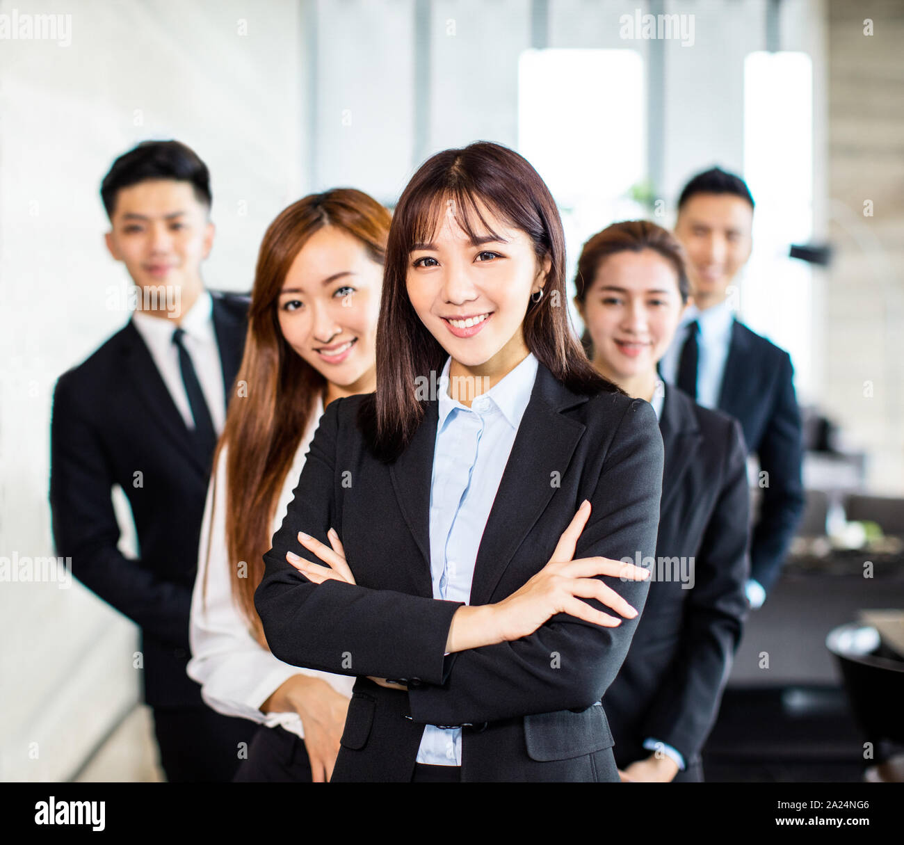 confident asian business team stands in office Stock Photo