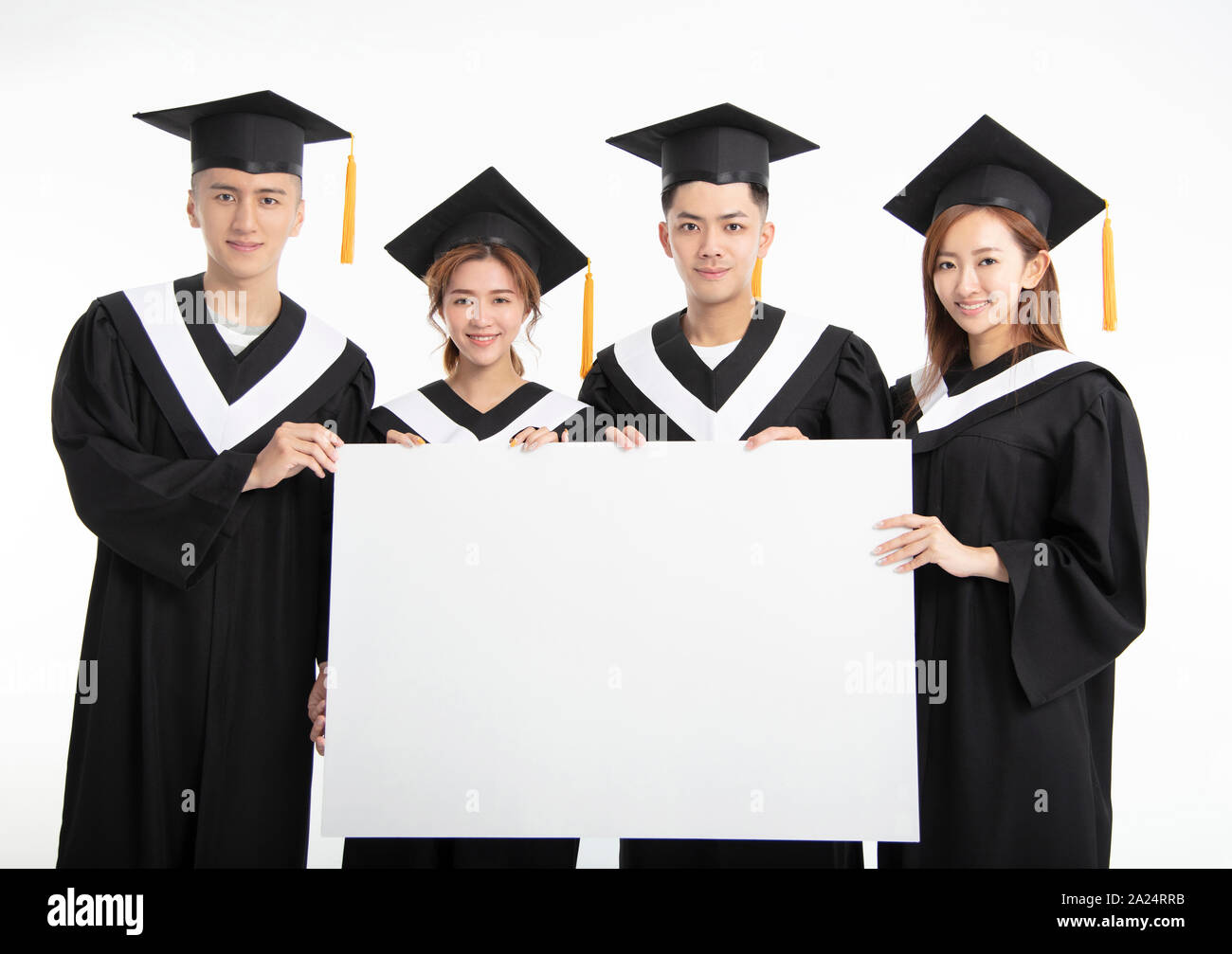 young Group of graduate students presenting empty banner Stock Photo
