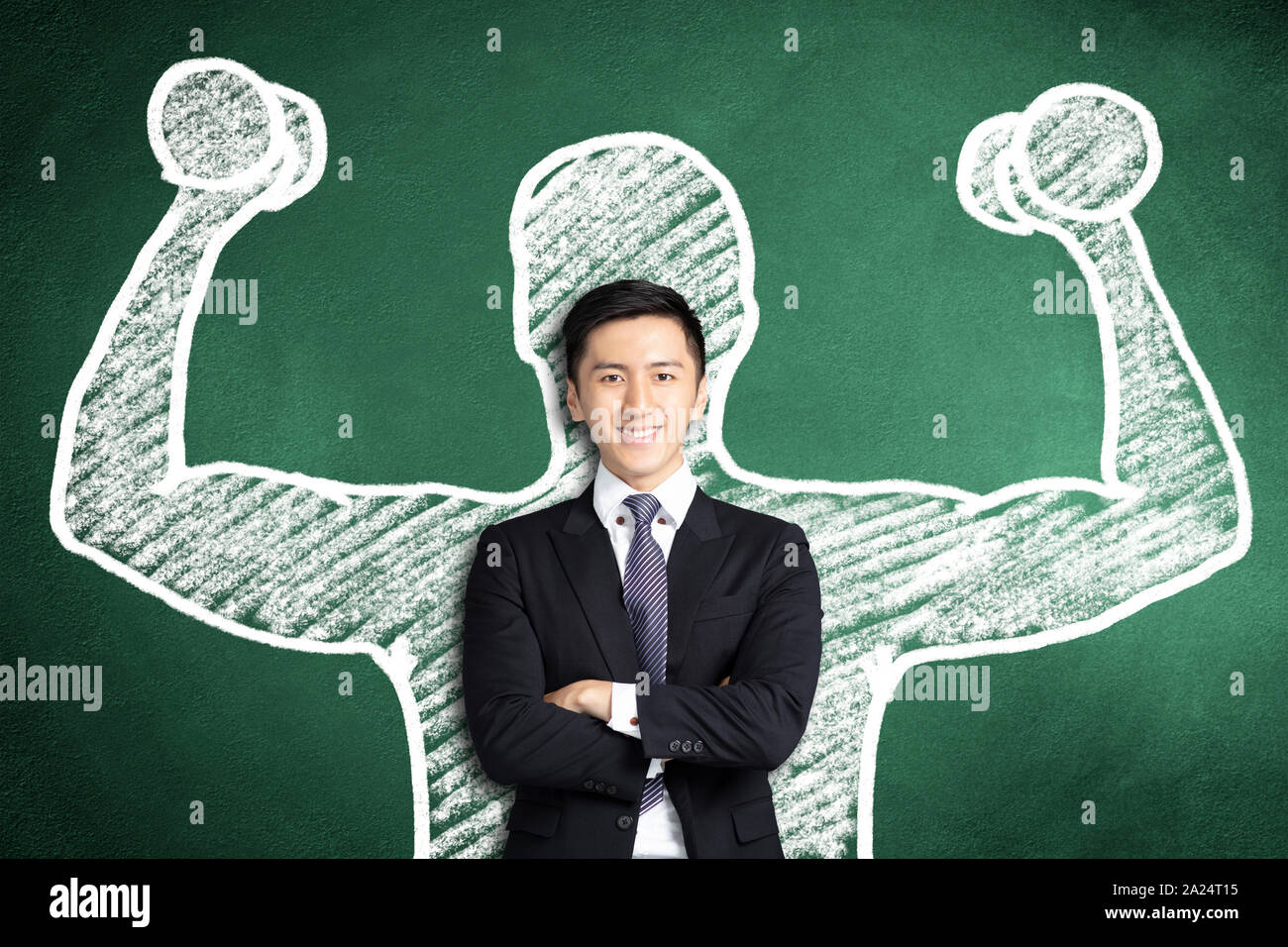 smiling asian business man with power gesture Stock Photo