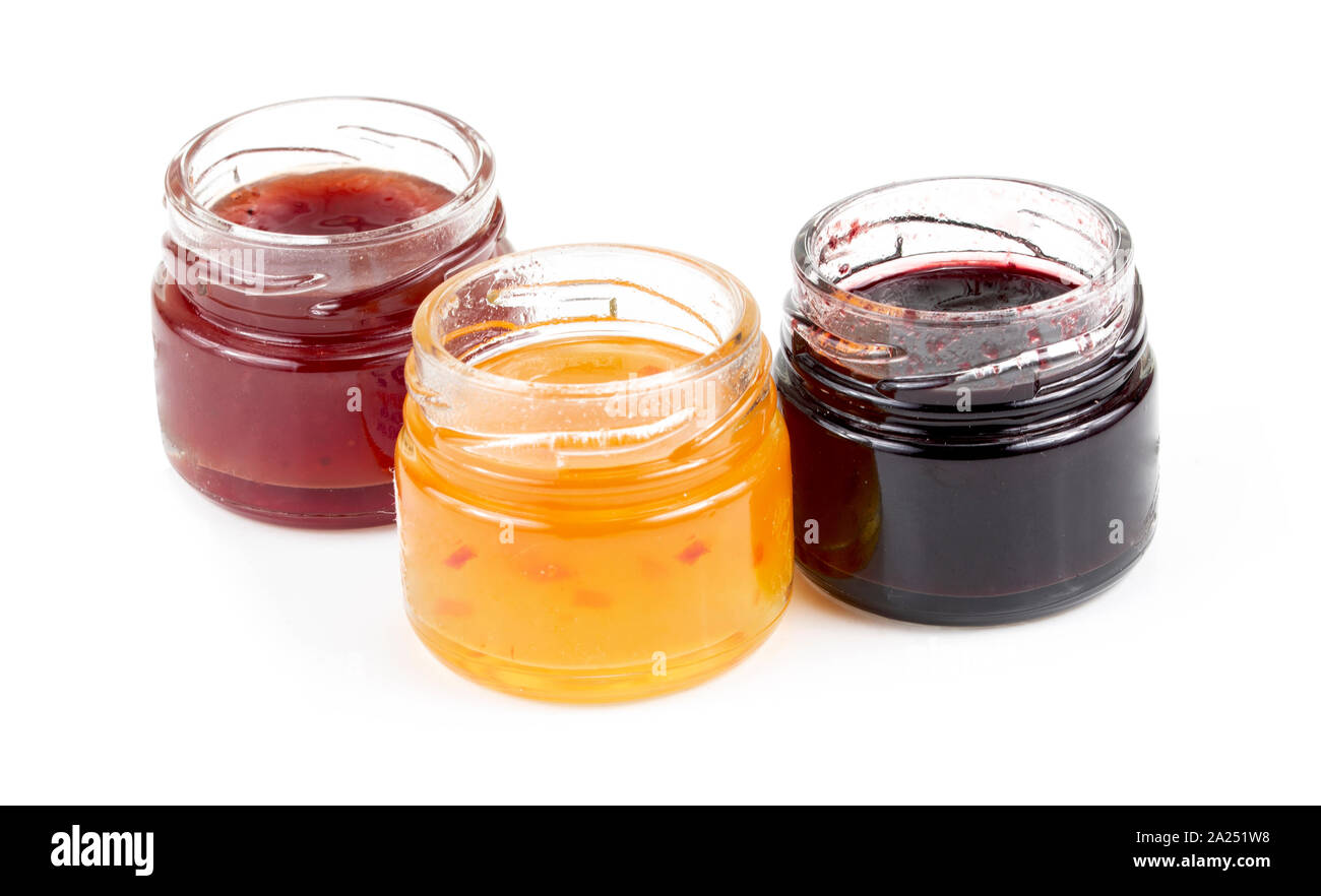 jars full of fresh homemade colorful jams in glass Stock Photo