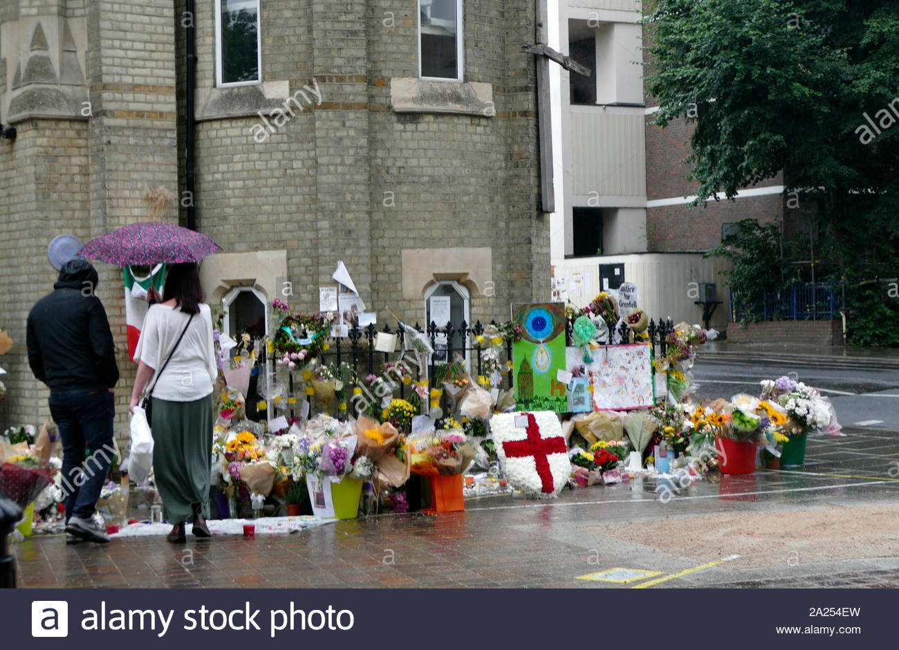 Floral tributes marking the Grenfell Tower fire in London. The fire occurred on 14 June 2017. at