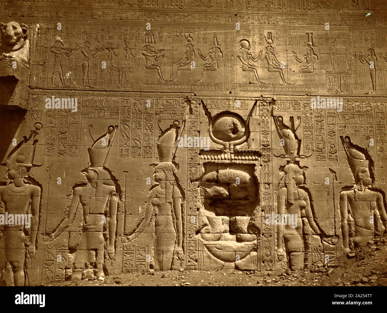 relief with hieroglyphics covers a wall in the Temple of Hathor, located in Dendera, Egypt. Dendera Temple complex. It is one of the best-preserved temple complexes in Egypt. The area was used as the sixth Nome of Upper Egypt, south of Abydos. Stock Photo
