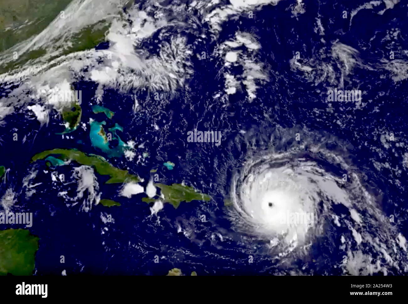 GOES-13 satellite image taken Wednesday, Sept. 6, 2017 at 7:15 a.m. EDT, Hurricane Irma tracks over Saint Martin and the Leeward Islands Stock Photo