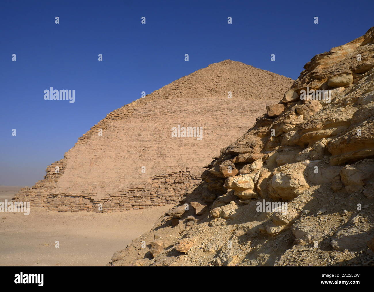 The Bent Pyramid and the Satellite Pyramid are ancient Egyptian pyramids located at the royal necropolis of Dahshur, approximately 40 kilometres south of Cairo, built under the Old Kingdom Pharaoh Sneferu (c. 2600 BC). Stock Photo