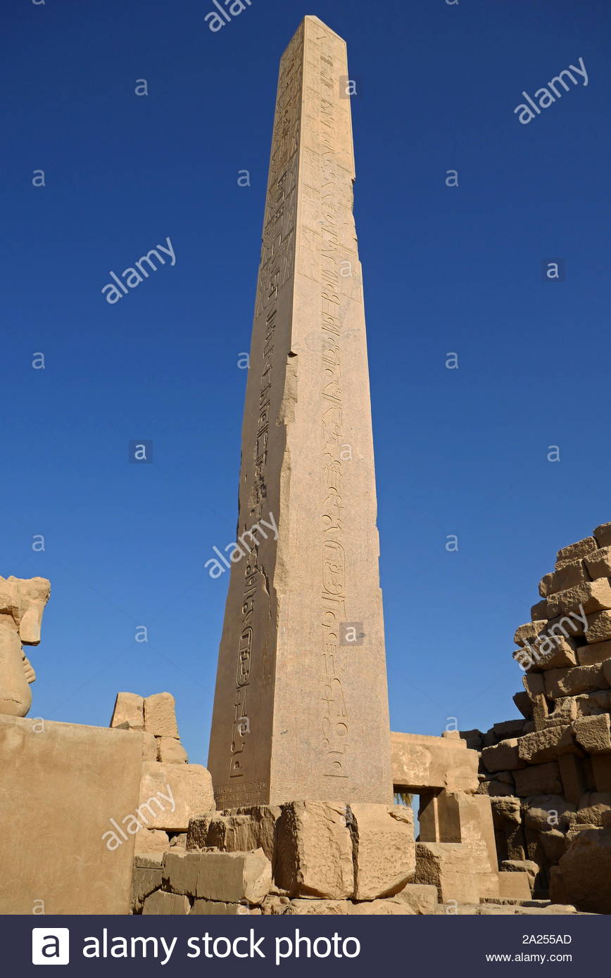 obelisk of Hatshepsut at Karnak Temple Complex, in Luxor, Egypt. Construction at the complex began during the reign of Senusret I in the Middle Kingdom and continued into the Ptolemaic period, although most of the extant buildings date from the New Kingdom. The area around Karnak was the main place of worship of the eighteenth dynasty Theban Triad with the god Amun as its head. It is part of the monumental city of Thebes. Stock Photo