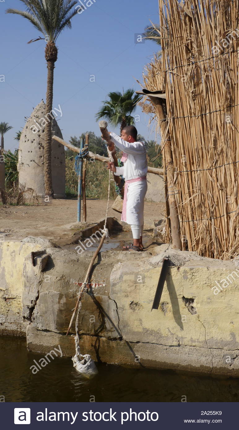 Replica of an ancient Egyptian village with a shadoof or shaduf, irrigation tool. The shadoof was an early tool used in irrigation by the ancient Egyptians who lived along the Nile River and the Mesopotamians. Stock Photo