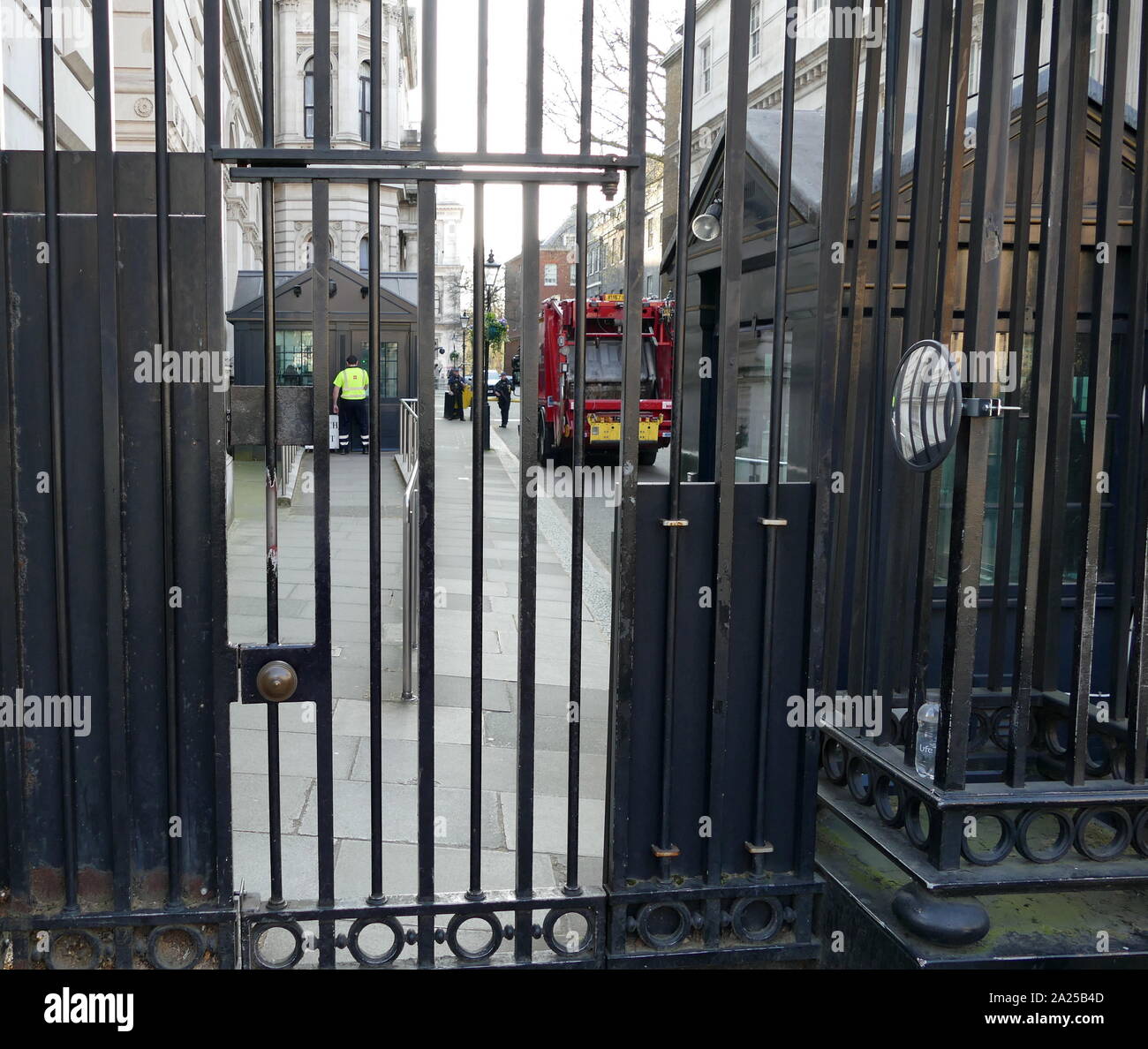 Refuse lorry is security checked before passing in front of the Prime Minister's Office in Downing Street, London. 2019 Stock Photo