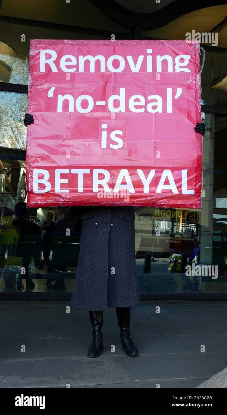 Brexit 'Leave' protest placard 'Removing no-deal is a betrayal' displayed near Parliament in London, April 2019.Brexit is the process of the withdrawal of the United Kingdom (UK) from the European Union (EU). Following a referendum held on 23 June 2016 in which 51.9 per cent of those voting supported leaving the EU Stock Photo