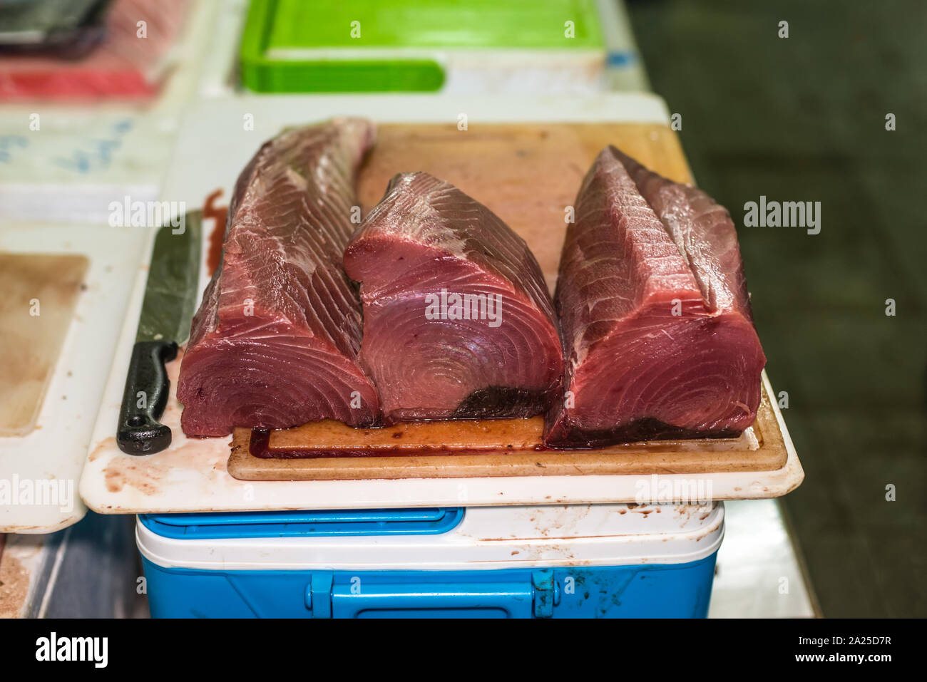 Image of Fisherman (Salesman) Is Cutting Fresh Tuna Fish In The Open Air  Fish Market Or Restaurant-YP686846-Picxy