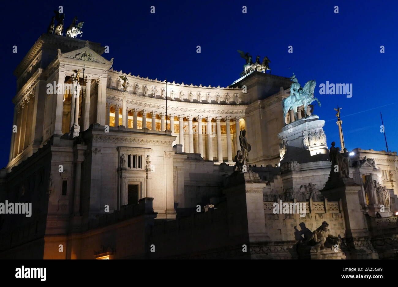 View of the Vittorio Emanuele II Monument at night. The Vittorio Emanuele II Monument, also known as the Vittoriano, Il Vittoriano, or Altare della Patria, is a monument built in honour of Victor Emmanuel II, the first king of a unified Italy, located in Rome, Italy. Stock Photo