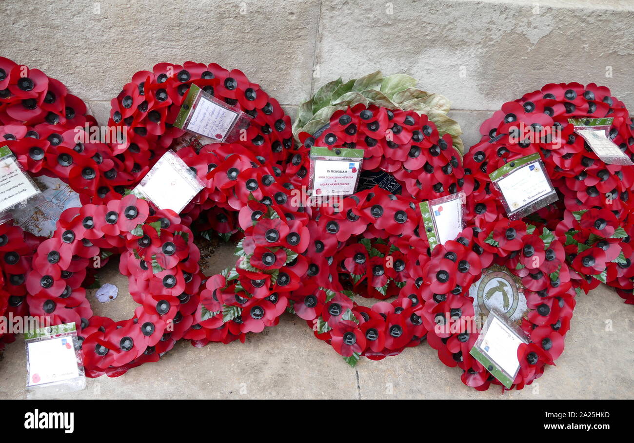 Wreaths of artificial poppies laid in commemoration of war dead at the Cenotaph, London, United Kingdom Stock Photo