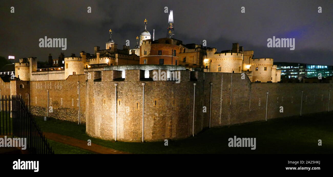 The Tower of London, in central London. It was founded towards the end of 1066 as part of the Norman Conquest of England. In the distance is the modern skyscraper known as the Shard. Stock Photo