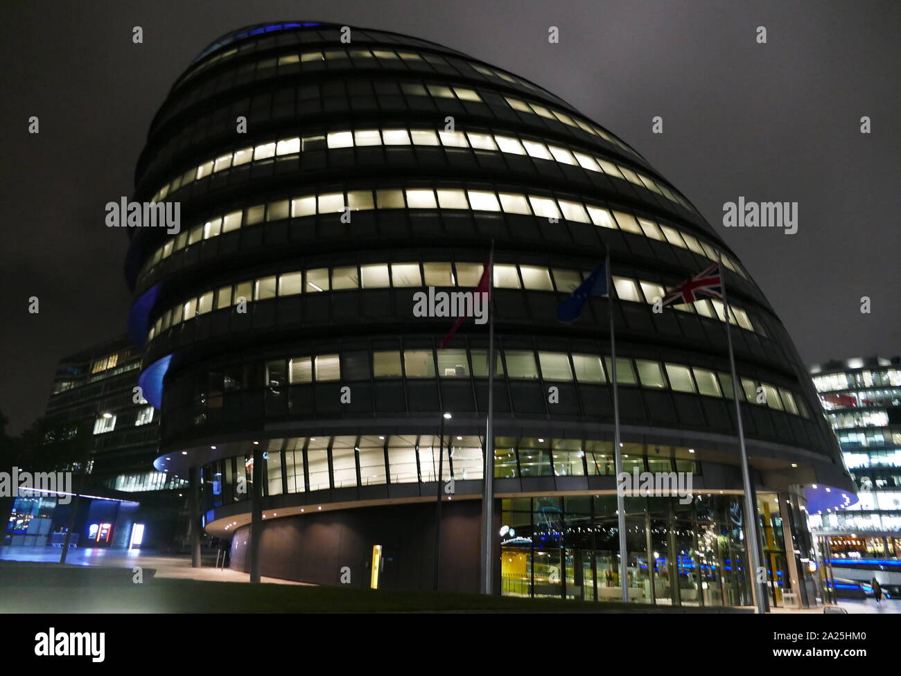 City Hall; headquarters of the Greater London Authority (GLA), which comprises the Mayor of London and the London Assembly. It is located in Southwark, on the south bank of the River Thames near Tower Bridge. It was designed by Norman Foster and opened in July 2002, Stock Photo