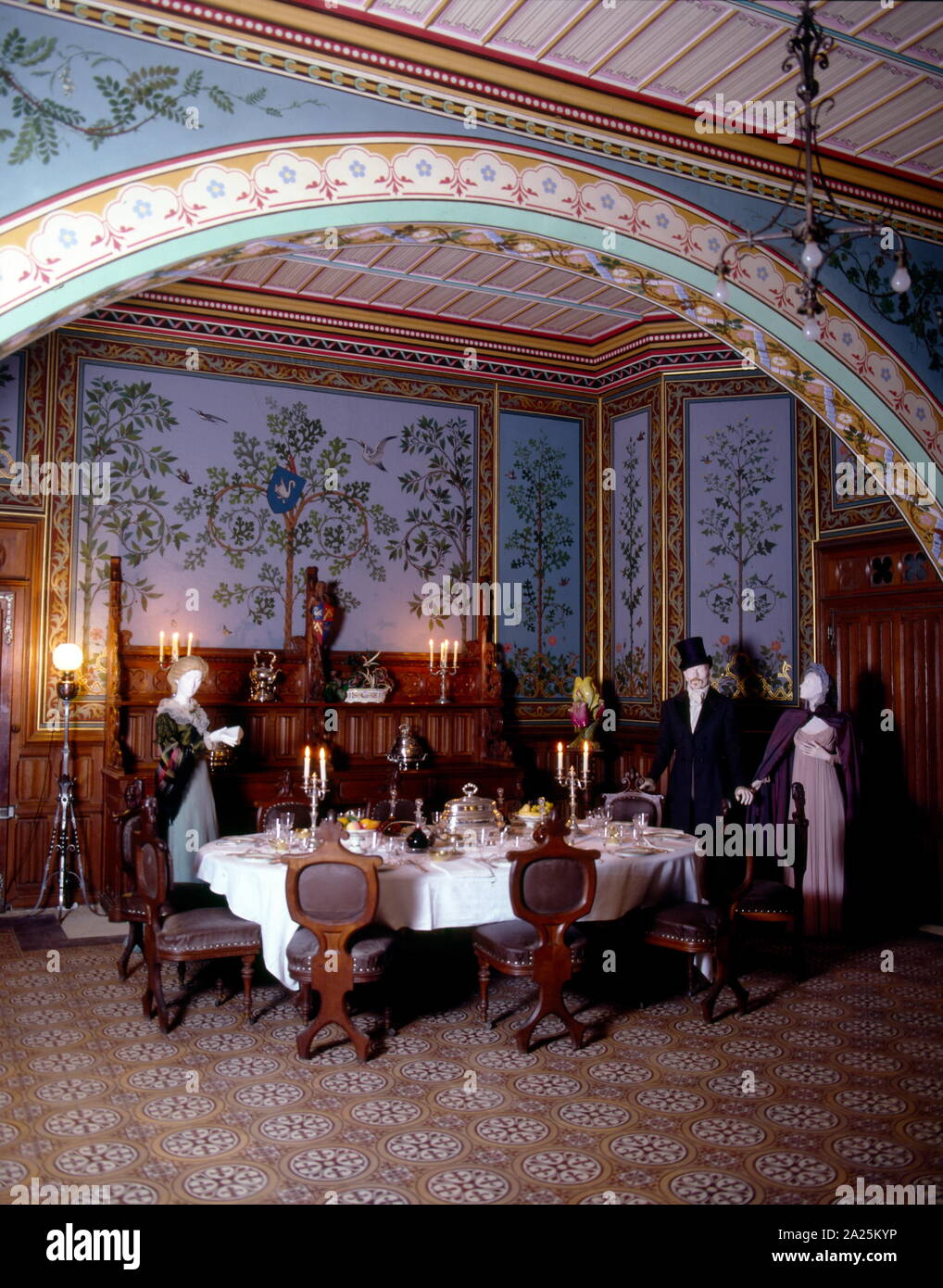 19th century dining room, in the Château de Roquetaillade; a castle in Mazères (near Bordeaux), France. The decor and fittings were supervised by Viollet-le-Duc during the 19th century. Eugène Emmanuel Viollet-le-Duc (1814 – 1879) was a French architect and theorist, famous for his interpretive 'restorations' of medieval buildings Stock Photo