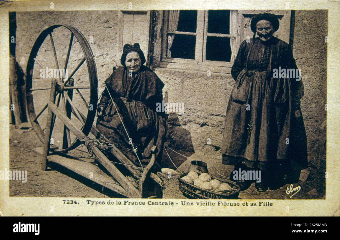 Two old women with a textile spinning loom, Rural France 1900 