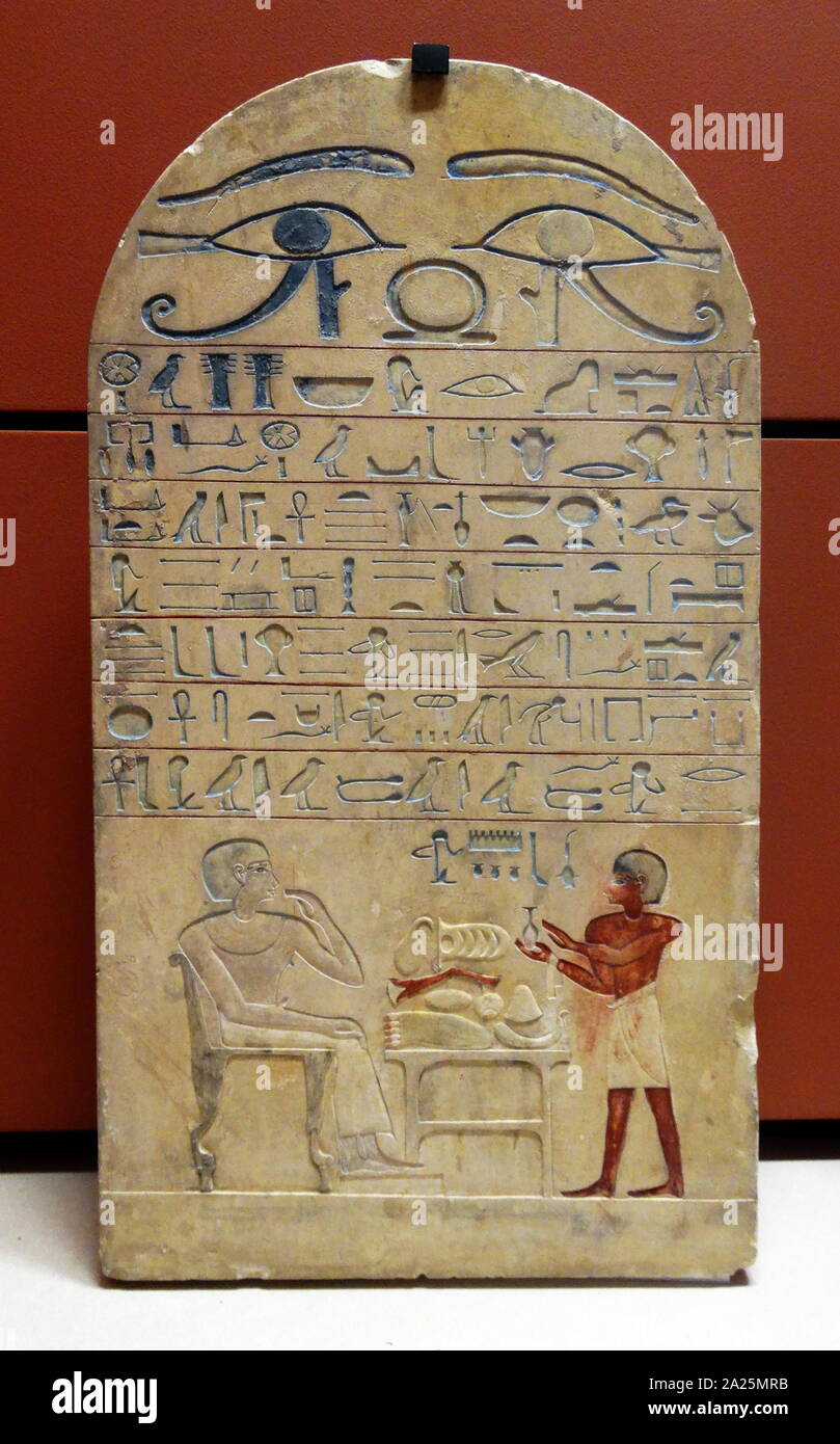 Egyptian stele depicting the cupbearer, Ouhemmenou, offering a to drink to the high steward Iat at a meal Stock Photo