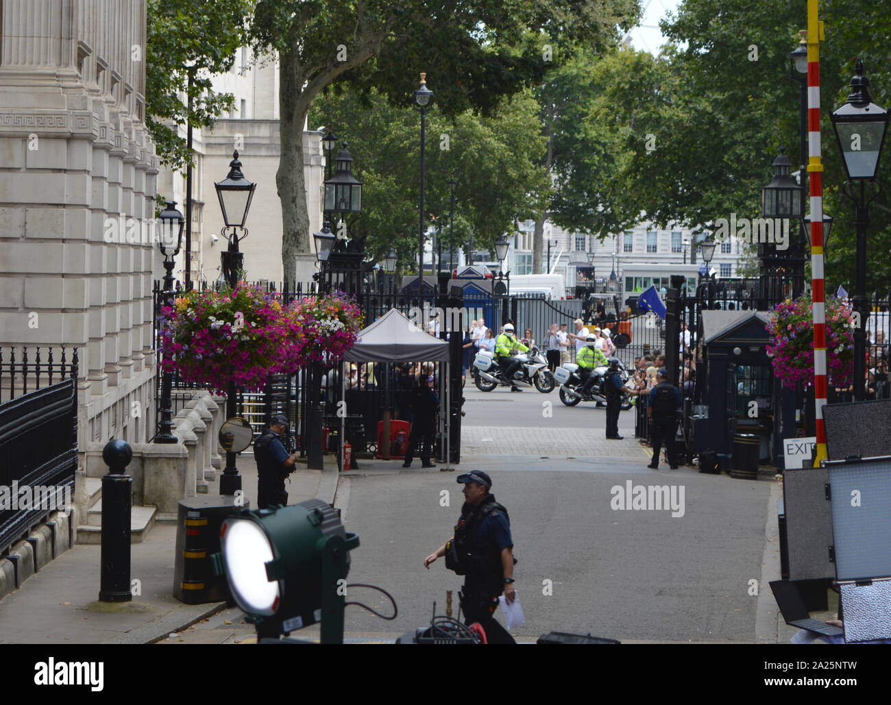 Press gathered in downing street, london, for the arrival of incoming new prime minister, boris johnson. downing street is the official residences and offices of the prime minister of the united kingdom and the chancellor of the exchequer. situated off whitehall, a few minutes' walk from the houses of parliament, downing street was built in the 1680s by sir george downing. Stock Photo