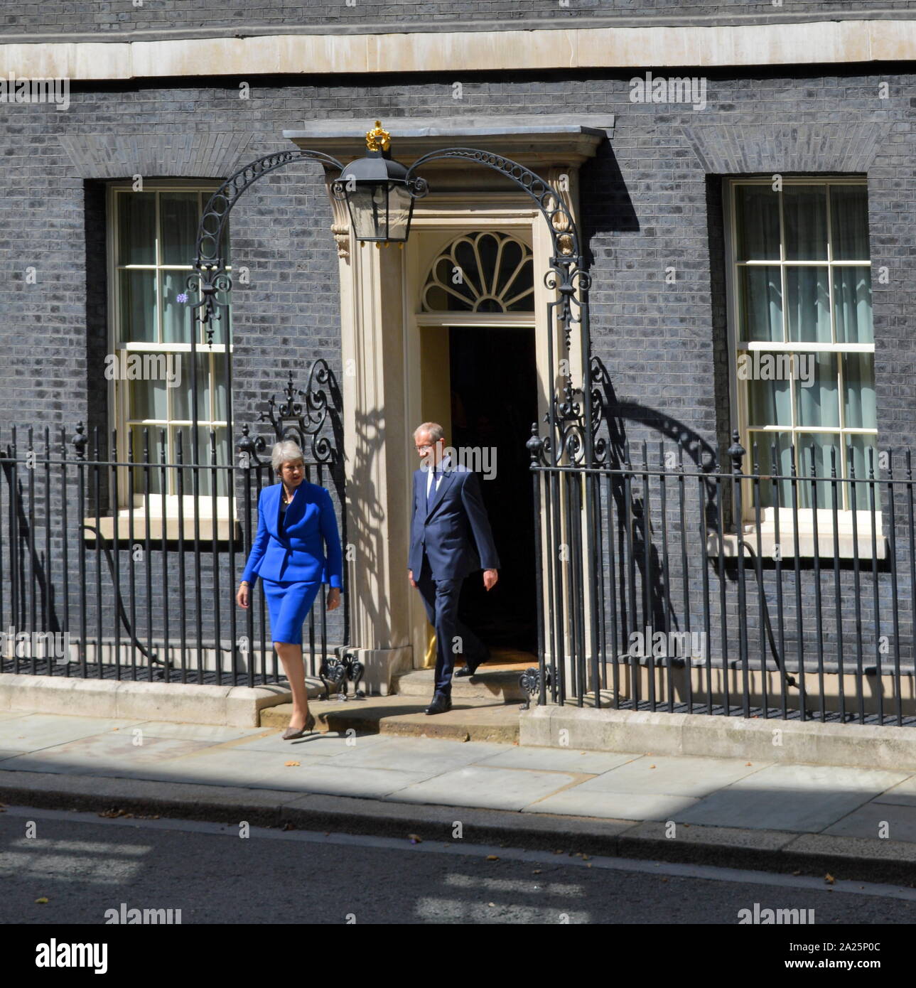 Theresa may leaves 10 downing street to make her resignation speech, london, before seeing queen elizabeth to formalise her departure. the last day of the premiership of theresa may, prime minister of the united kingdom, 13 july 2016 - 24 july 2019. may was leader of the conservative party from july 2016 - 23 july 2019. shown with her husband phillip may. Stock Photo