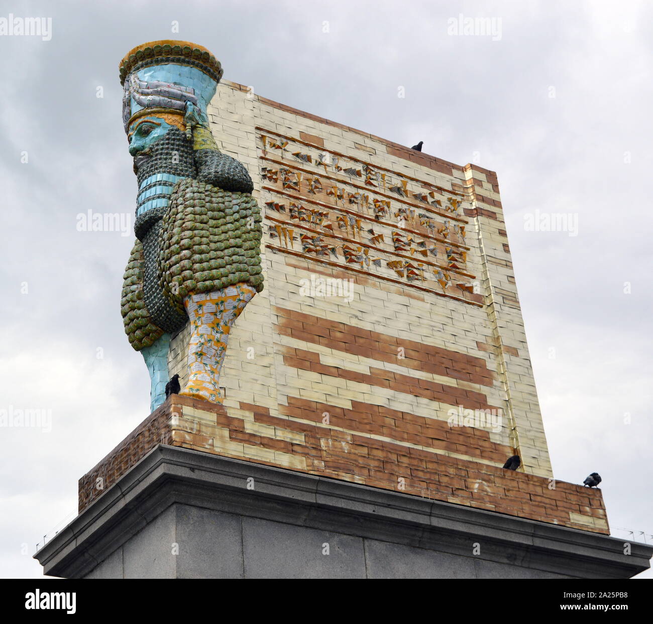 The Invisible Enemy Should Not Exist' by Michael Rakowitz b. 1973, New York. In 2006 Michael Rakowitz started his project The Invisible Enemy Should Not Exist to recreate over 7,000 archaeological artefacts looted from the Iraq Museum during the war or destroyed elsewhere. One of these was the Lamassu, a winged deity. It guarded Nergal Gate at the entrance to the ancient Assyrian city of Nineveh, near modern-day Mosul, Iraq, in c700 B.C. until 2015 when it was destroyed by ISIS. Unveiled 28 March 2018 by Sadiq Khan, Mayor of London, the Trafalgar Square, Fourth Plinth Programme Stock Photo