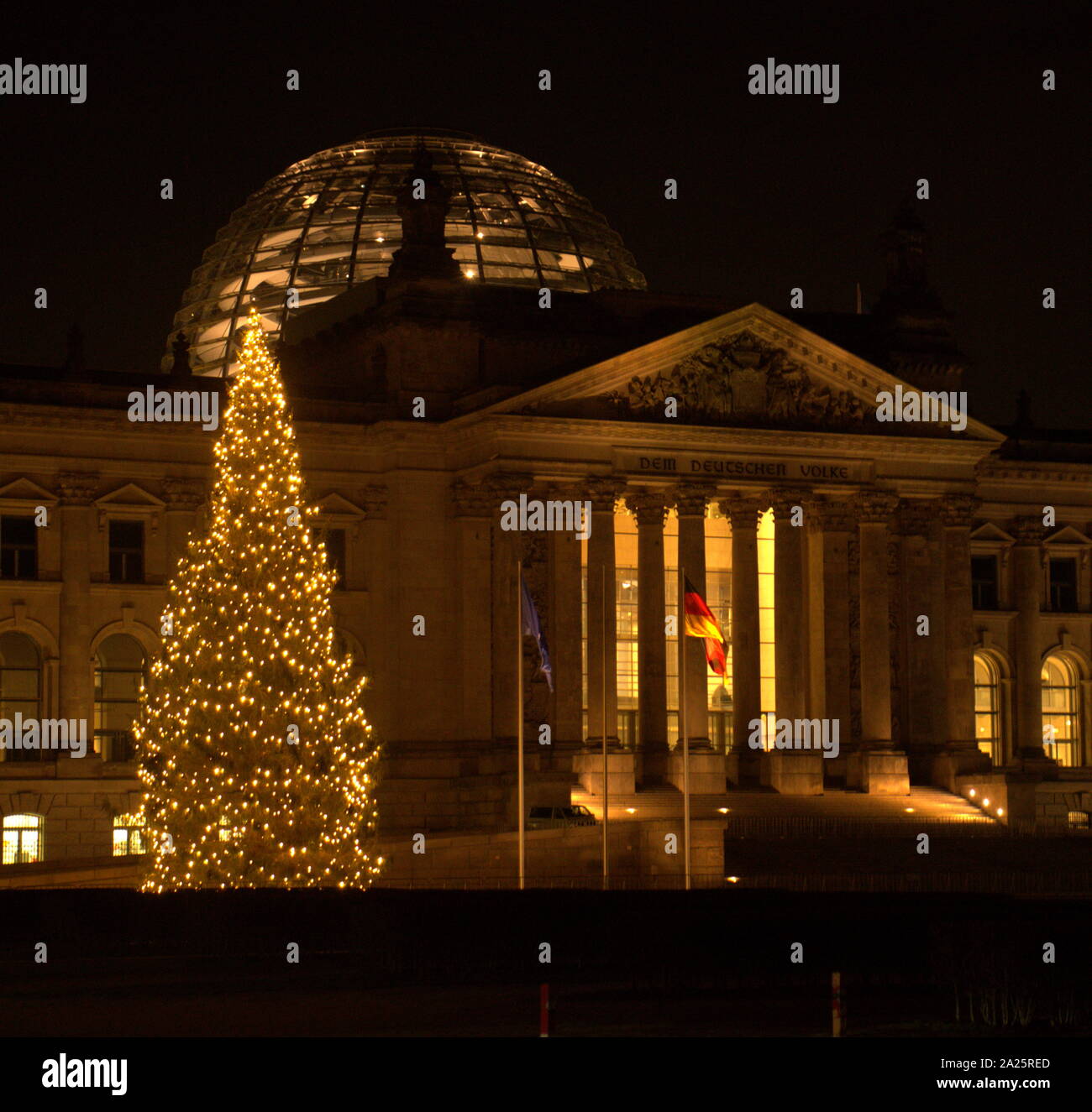 The Reichstag (Deutscher Bundestag), in Berlin, Germany at Christmass. Constructed to house the Imperial Diet (German: Reichstag) of the German Empire. It was opened in 1894 and housed the Diet until 1933, when it was severely damaged after being set on fire. After World War II, the building fell into disuse. After German reunification on 3 October 1990, when it underwent a reconstruction led by architect Norman Foster. After its completion in 1999, it once again became the meeting place of the German parliament: the modern Bundestag. Stock Photo