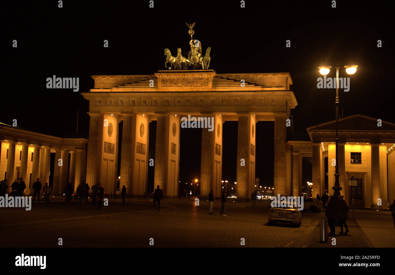 The Brandenburg Gate (Brandenburger Tor) viewed at night. An 18th-century neoclassical monument in Berlin, built on the orders of Prussian king Frederick William II after the restoration of order during the early Batavian Revolution. One of the best-known landmarks of Germany, Stock Photo