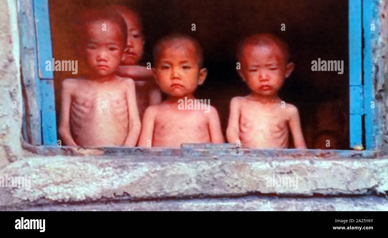 Photograph of emaciated orphans in North Korea. North Korea, officially the Democratic People's Republic of Korea, suffered a famine that resulted in the deaths of between 240,000 and 420,000 people from 1994 and 1998. The population continues to suffer malnutrition. Stock Photo