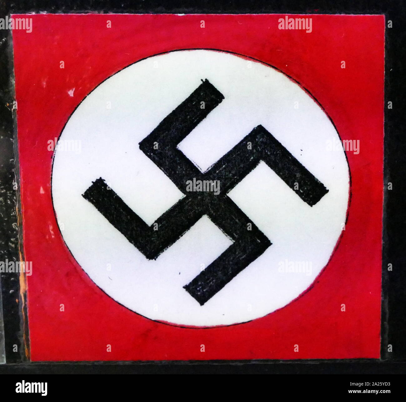 A Nazi insignia (Swastika). Stock Photo