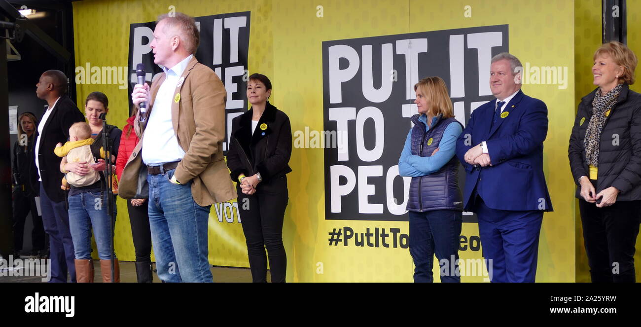 Phillip James Lee, British, Conservative politician, Member of Parliament (MP) for Bracknell, addresses the 'People's Vote' march in Parliament Square, London. The People's Vote march took place in London on 23 March 2019 as part of a series of demonstrations to protest against Brexit, call for a new referendum, and ask the British Government to revoke Article 50. It brought to the capital hundreds of thousands of protestors, or over a million people according to the organizers. Stock Photo