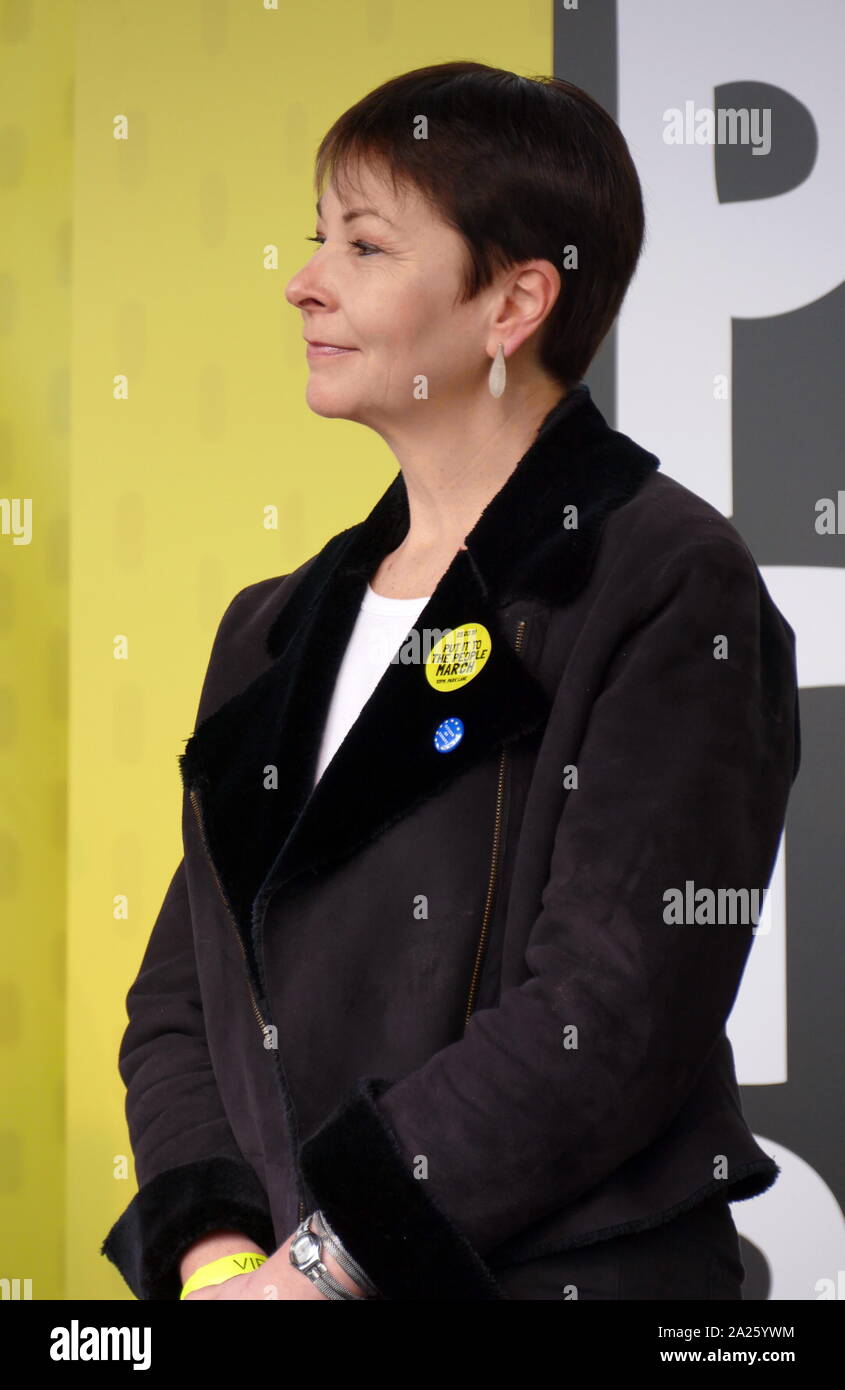 Caroline Lucas; British; Green Party; politician at the 'People's Vote' march in Parliament Square, London. Caroline Lucas; British; Green Party; politician; Member of Parliament (MP) for Brighton Pavilion, addresses the 'People's Vote' march in Parliament Square, London. The People's Vote march took place in London on 23 March 2019 as part of a series of demonstrations to protest against Brexit, call for a new referendum, and ask the British Government to revoke Article 50. It brought to the capital hundreds of thousands of protestors, or over a million people according to the organizers. Stock Photo