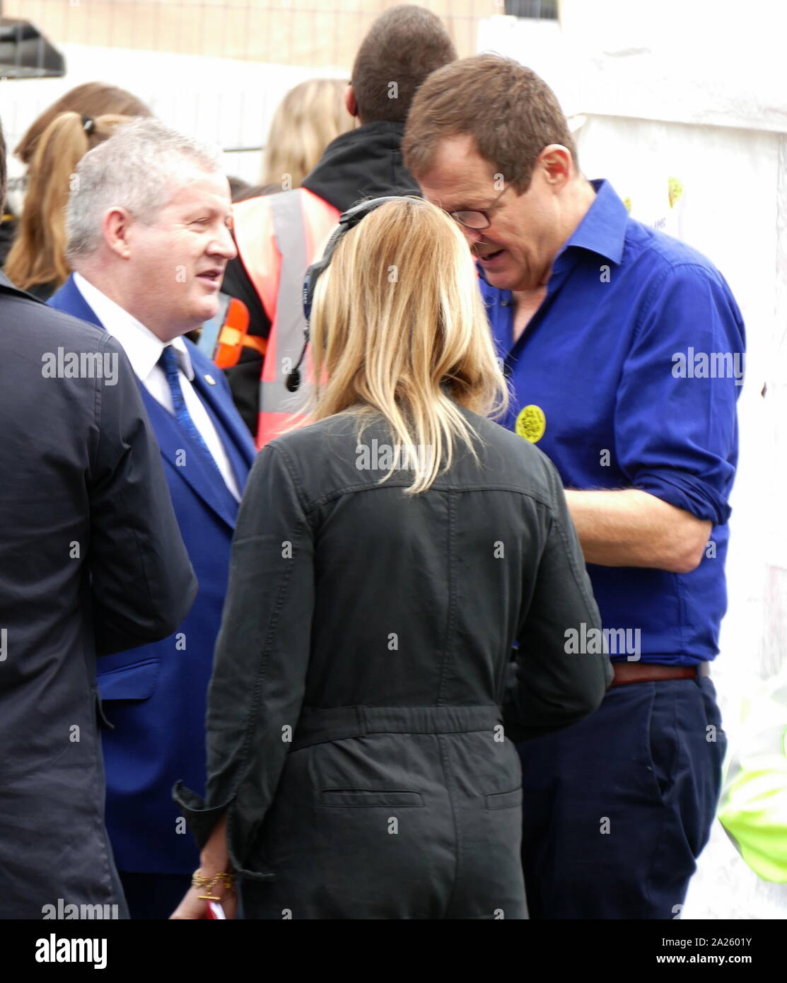 Alastair Campbell, former Labour Press consultant and spin doctor (right), with Ian Blackford, Scottish National Party Member of Parliament for Ross, Skye and Lochaber, leader of the SNP Westminster Group, at the 'People's Vote' march in Parliament Square, London. The People's Vote march took place in London on 23 March 2019 as part of a series of demonstrations to protest against Brexit, call for a new referendum, and ask the British Government to revoke Article 50. It brought to the capital hundreds of thousands of protestors, or over a million people according to the organizers. Stock Photo