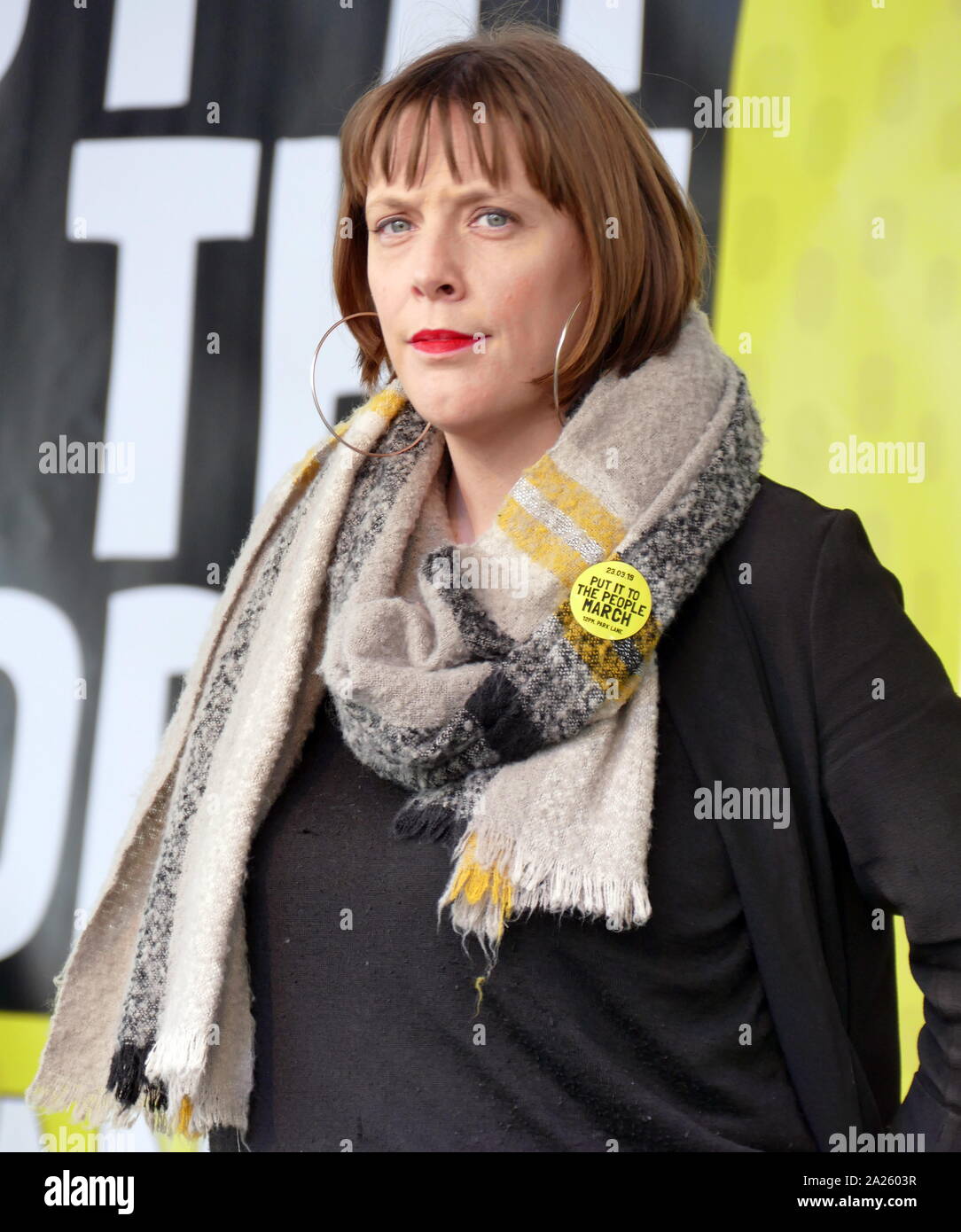 Jess Phillips, Labour Member of Parliament (MP) for Birmingham Yardley, addresses the 'People's Vote' march in Parliament Square, London. The People's Vote march took place in London on 23 March 2019 as part of a series of demonstrations to protest against Brexit, call for a new referendum, and ask the British Government to revoke Article 50. It brought to the capital hundreds of thousands of protestors, or over a million people according to the organizers. Stock Photo