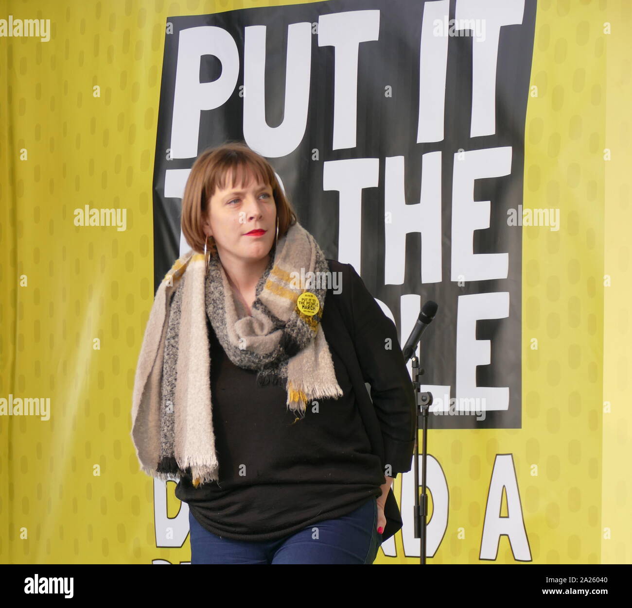 Jess Phillips, Labour Member of Parliament (MP) for Birmingham Yardley, addresses the 'People's Vote' march in Parliament Square, London. The People's Vote march took place in London on 23 March 2019 as part of a series of demonstrations to protest against Brexit, call for a new referendum, and ask the British Government to revoke Article 50. It brought to the capital hundreds of thousands of protestors, or over a million people according to the organizers. Stock Photo