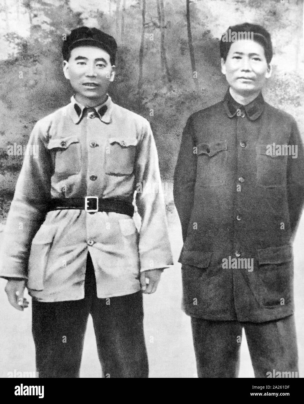Lin Biao (left) standing with Nie Rongzhen, before an enemy plane seized in the Battle of Zhangzhou 1934. Lin Biao (1907 - 1971). Lin became instrumental in creating the foundations for Mao Zedong's cult of personality, and was rewarded in the Cultural Revolution by being named Mao's designated successor. Lin died on September 13, 1971. Nie Rongzhen (1899 - 1992) was a prominent Chinese Communist military leader, and one of ten Marshals in the People's Liberation Army of China. Stock Photo