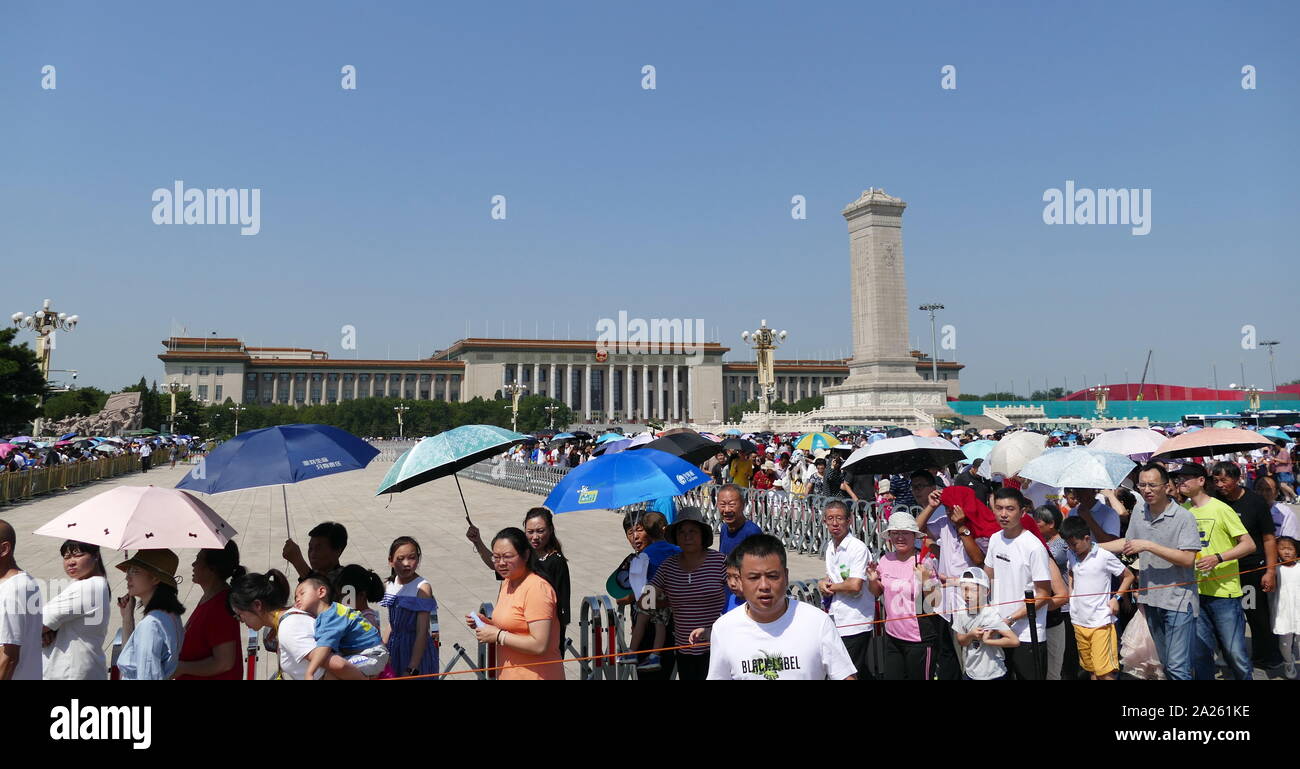 The Monument to the People's Heroes stands in front of the Great Hall of the People, Beijing. A ten-story obelisk that was erected as a national monument of China to the martyrs of revolutionary struggle during the 19th and 20th centuries Stock Photo