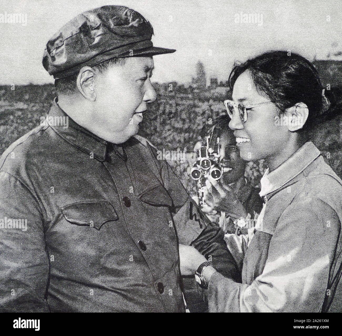 Chairman Mao with female Red Guard, during the Cultural Revolution. 1966. Mao Zedong (1893 - September 9, 1976), was a Chinese communist revolutionary who became the founding father of the People's Republic of China (PRC), which he ruled as the Chairman of the Communist Party of China from its establishment in 1949 until his death Stock Photo