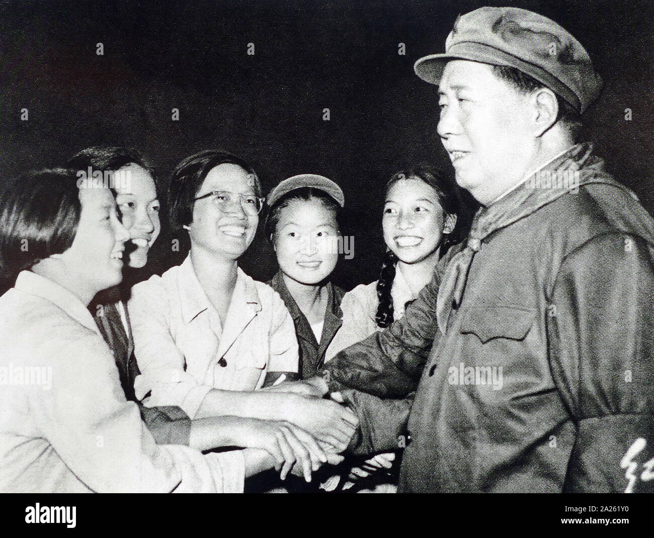 Chairman Mao with female Red Guards during the Cultural Revolution. 1966. Mao Zedong (1893 - September 9, 1976), was a Chinese communist revolutionary who became the founding father of the People's Republic of China (PRC), which he ruled as the Chairman of the Communist Party of China from its establishment in 1949 until his death Stock Photo