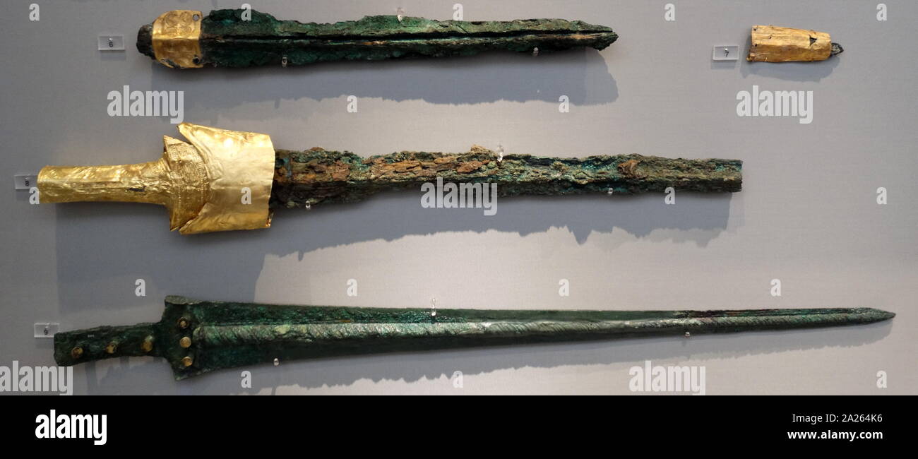 Swords made from bronze with gilded attributes, from Circle A, a 16th-century BC royal cemetery, of the Bronze Age citadel of Mycenae in southern Greece. Characteristic of the early phase of the Mycenaean civilization Stock Photo